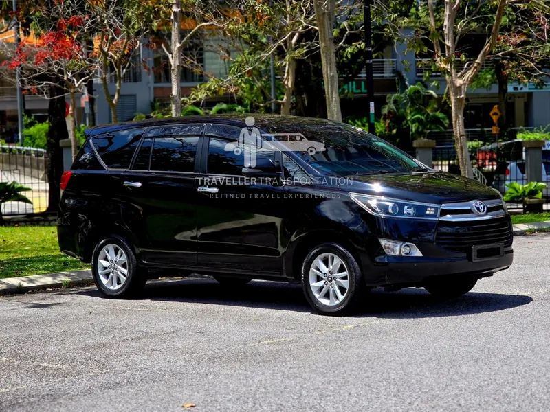 Black Toyota Innova with Traveller Transportation branding