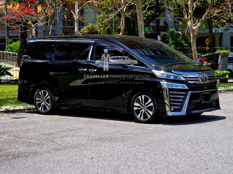 Black Toyota Vellfire with Traveller Transportation branding
